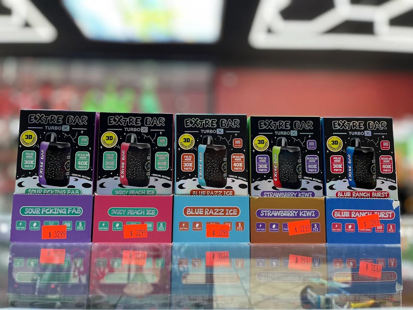Premium vape selection displayed on dark shelves